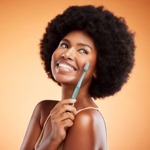 woman smiling with toothbrush